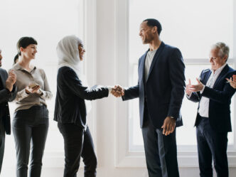 happy-diverse-business-people-making-deal